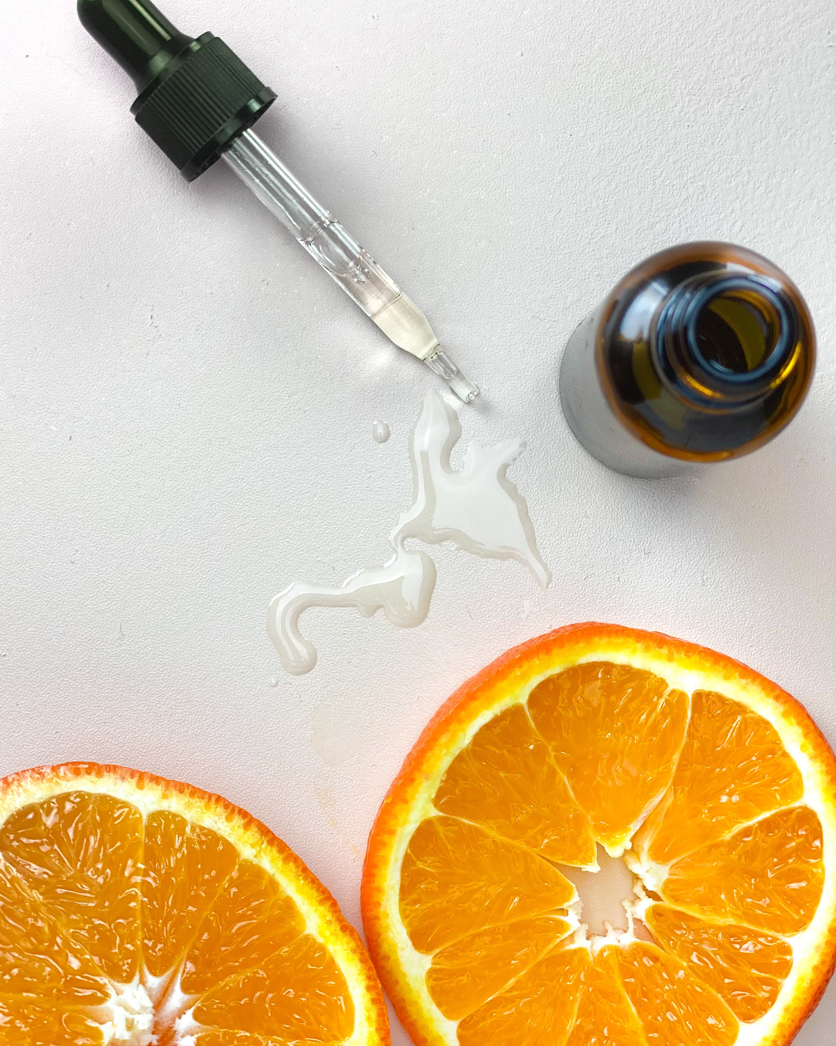 Vitamin C + Squalane Serum formula with oranges